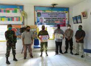 Babinsa Koramil Wotu dan Bhabinkamtibmas Kawal Penyaluran BLT DD di Desa Lanosi