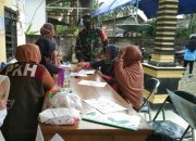 Berikan Rasa Aman, Babinsa Koramil 1403-13 Wotu Dampingi Warga Desa Lanosi Lutim Terima BST Kemensos RI Tahap II